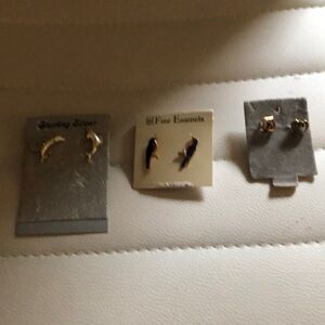 3 pairs of post earrings silver dolphins, blue bird, and hearts.